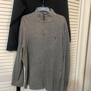 Mens Q-Zip Pullover. Grey in color, with red logo.